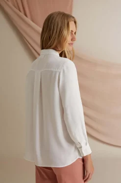 Kristina Kauluspaita, Luonnonvalkoinen><noscript><img width=